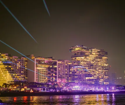 Dubai NYE Marina Night View: Illuminated Skyscrapers with Laser Lights and Waterfront Glow